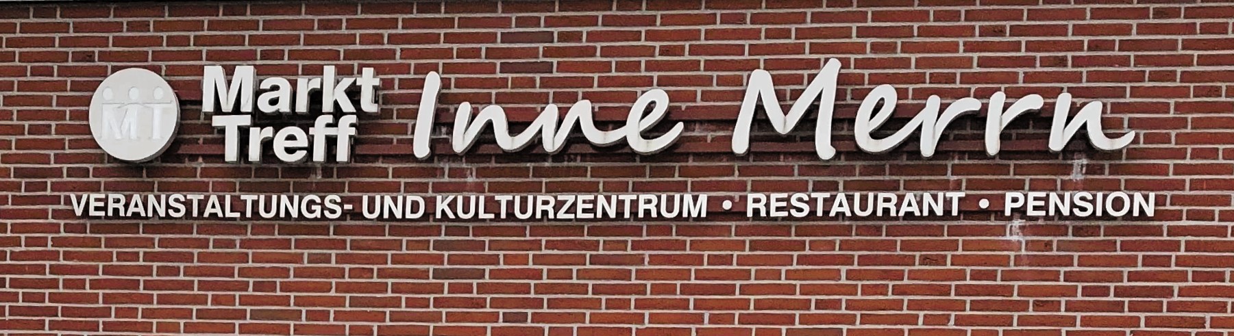 Wandschild des Markt Treff Inne Merrn